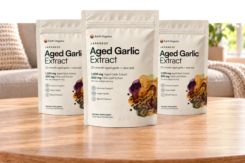 Three white Earth Organics Aged Garlic Extract packs